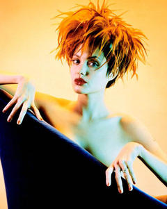 Angelina Jolie undressed in armchair