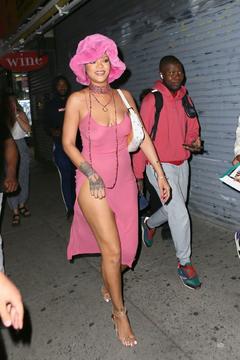 Rihanna braless in see through dress out at night in New York