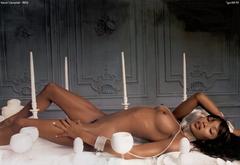 Black Naomi Campbell lying fully nude
