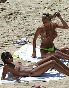 Naomi Ryan and Katy Edwards topless on a beach