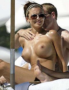 Busty Oksana Andersson sunbathing topless