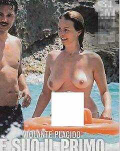 Violante Placido topless on a beach paparazzi photo