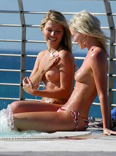 Vanessa Nimmo and Shell Jubin topless poolside