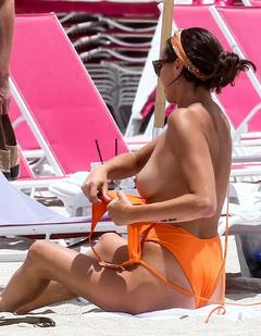 Kristen Doute changing on a beach shows her nude tits