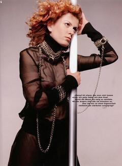 Debra Messing braless in see through dress