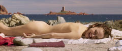 Natalie Portman sunbathing naked on a beach in Planetarium