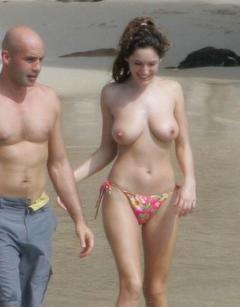 Kelly Brook topless on a beach with honey