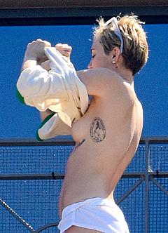 Miley Cyrus caught topless