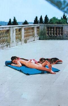 Italian singer Romina Power sunbathing naked but cover her ass