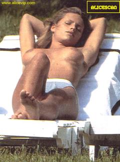 Michelle Hunziker sunbathing topless paparazzi photo