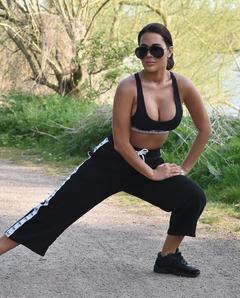 Yazmin Oukhellou stretching in a park in Essex