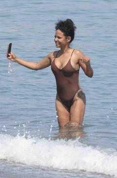 Christina Milian in a swimsuit during a fun beach day with her son in Marbella - July 2025