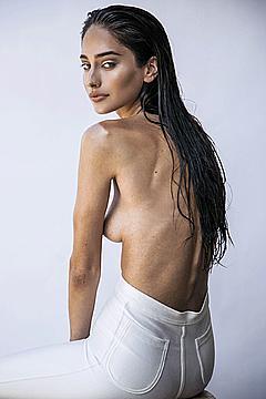 Taylor Hannum toples in white jeans