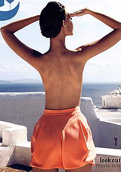 Tiiu Kuik topless in orange shorts