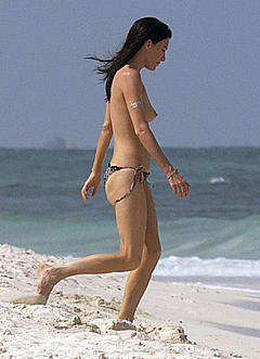 Jaime Murray topless at the beach in Mexico