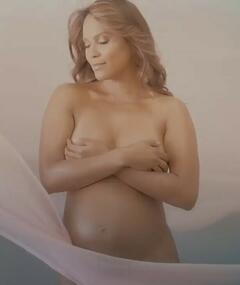 Pregnant Lesley-Ann Brandt nude cover her breasts