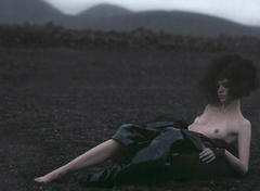 Mariacarla Boscono lying topless