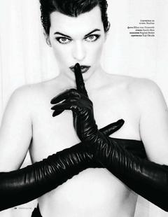 Milla Jovovich braless cover her tits