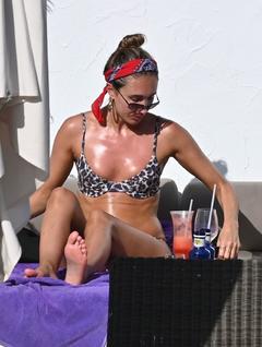 Megan McKenna in leopard print bikini at Nikki Beach in Marbella