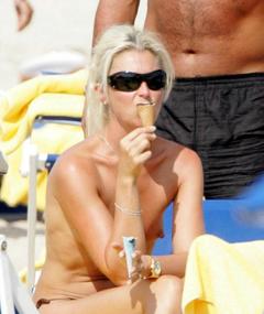 Tamara Beckwith topless eating ice cream on a beach in Italy