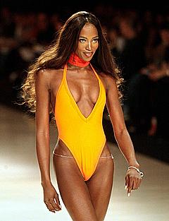 Naomi Campbell in yellow swimsuit runway image
