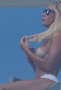 Blonde Laura Cremaschi topless on her hotel balcony in Miami beach