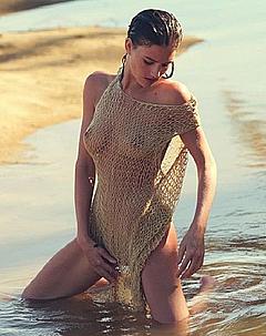 Eliza Cummings in fishnet transparent dress