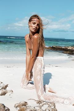 Maya Stepper topless on a beach