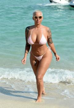 Amber Rose deep sexy cleavage in bikini at a beach in Miami