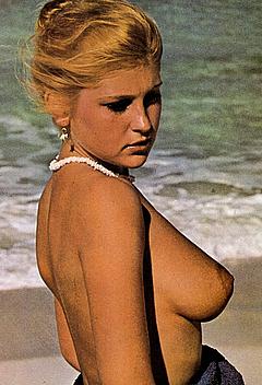 Adrienne Mandie nude breasts on a beach