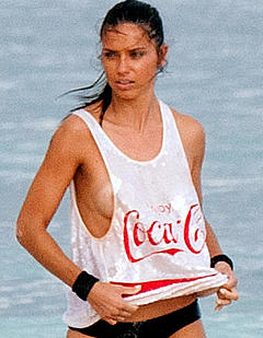 Adriana Lima behind the scene of a photoshoot in Cancun Mexico see through to nipples