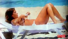 Cristina Parodi topless on a beach in Formentera