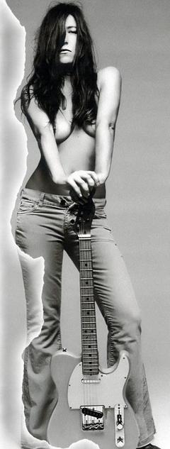 Paola Turci topless with guitar