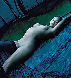 Tia Carrere lying fully nude