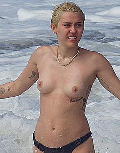 Blonde Miley Cyrus topless in Hawaii