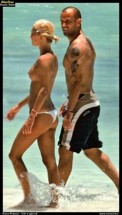 Katia Pedrotti topless on a beach paparazzi photo