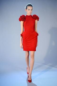 Regina Feoktistova in red mini dress