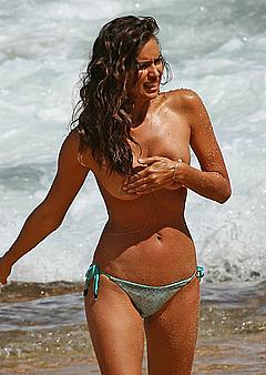 Irina Shayk topless on a beach cover her tits