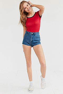 Josephine Skriver in denim shorts and red top for Urban Outfitters collection