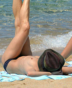 French actress and singer Vanessa Paradis sunbathing toples