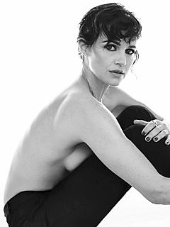 Actress Carla Gugino sitting topless