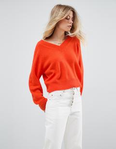 Alina Boyko in white jeans and orange top
