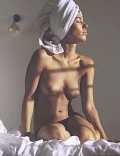 Alina Sueggeler nude on a bed