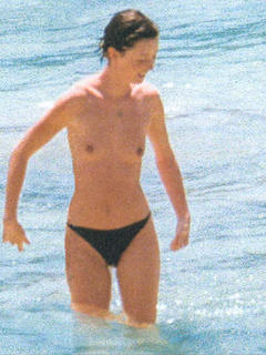 Audrey Marnay topless in a ocean paparazzi image