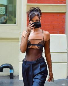 Bella Hadid braless in sheer top out in New York