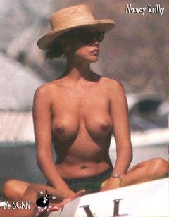 Nancy Brilli topless in a hat on a boat paparazzi photo