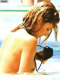 Elenoire Casalegno flashing her nude tits on a beach