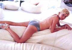 Gail Porter lying topless on a bed