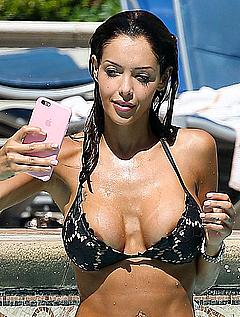 Nabilla Benattia making selfie shows areola slip