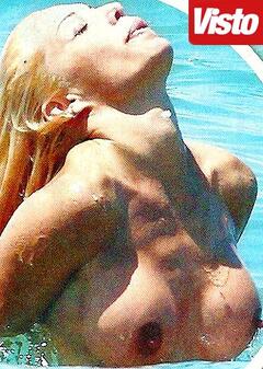 Giulia Montanarini topless in a water